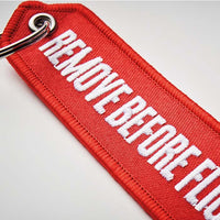 Embroidered key tag with triangular shaped end - Embroidered key tag with triangular shaped end